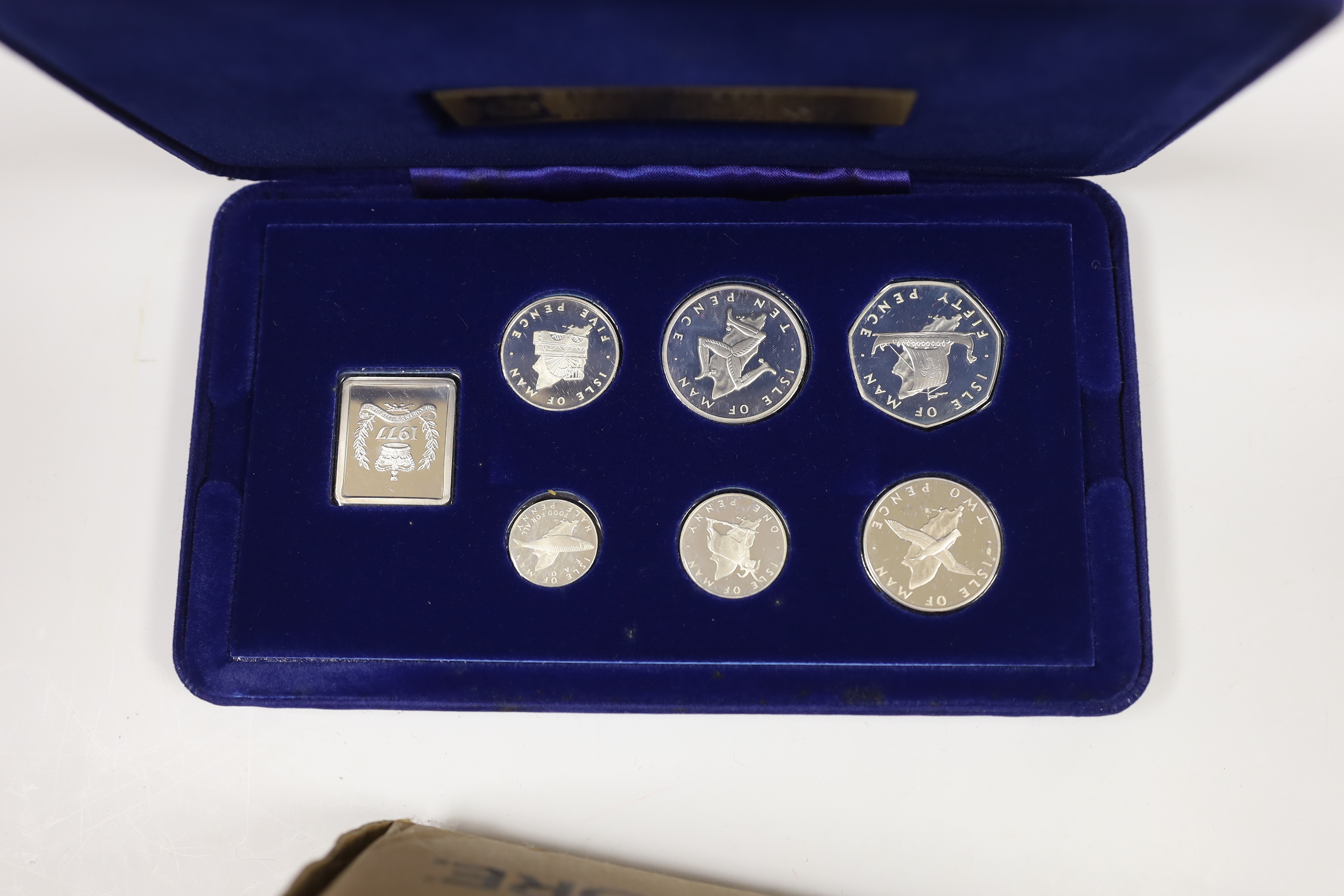 Queen Elizabeth II 1977 Silver Jubilee issues - two medallic first day covers, two cases of South Atlantic Coronation Crowns, cased Isle of Man proof silver coin set for 1977 and a silver gilt dish